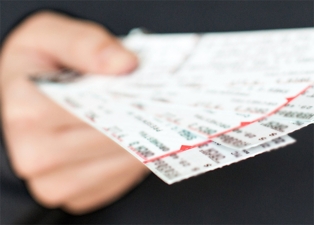 Image of hands holding tickets